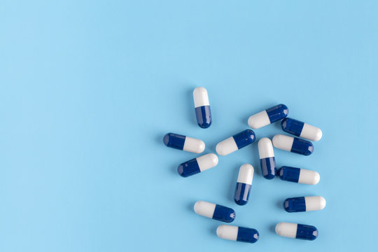 Blue-white medical capsules