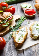 Fototapeta na wymiar Healthy sandwiches with vegetables on wood.
