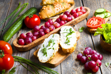 Healthy sandwiches with vegetables on wood.