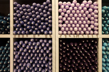 Multicolored candles. Candles in the shop window.