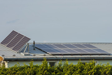 green energy, solar panels on the roof of a family house