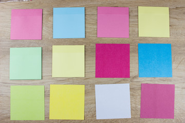 Сolorful paper blanks on wooden desk, Office concept. Empty space for design and text