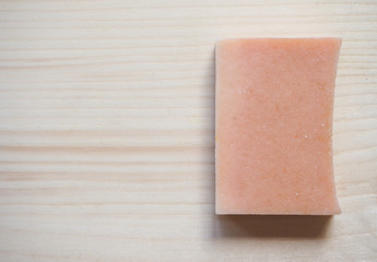 Soap economic on a wooden background. One piece handmade soap.