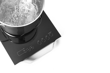 Portable induction cooktop and frying pan on white background