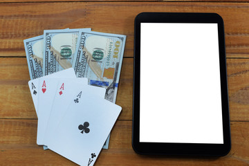 virtual casinos, real money. cell phone, dollar and playing cards