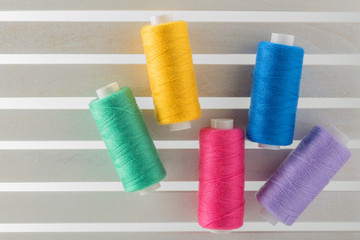 Color sewing thread used  in fabric and textile industry yellow blue red green