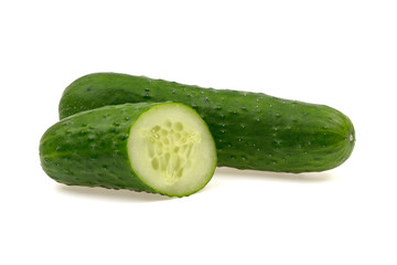 sliced green cucumber on a white background