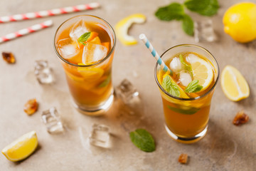 Iced tea with lemon and ice cubes