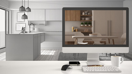 Architect house project concept, desktop computer on white work desk showing real finished minimalist white and wooden kitchen, unfinished CAD sketch or drawing interior design in the background