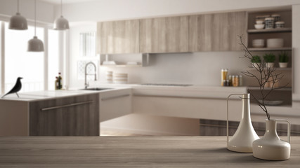 Fototapeta na wymiar Wooden table top or shelf with minimalistic modern vases over blurred minimalist modern kitchen, white architecture interior design