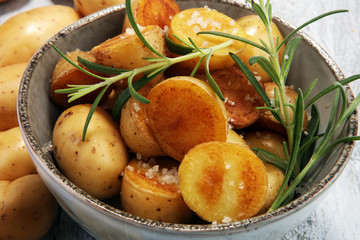 Roasted potato with fresh rosemary in a bowl