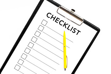 Blank checklist with space for ticks on pad on office desk. Checklist for office worker, manager, businessman, chief on white background top view closeup