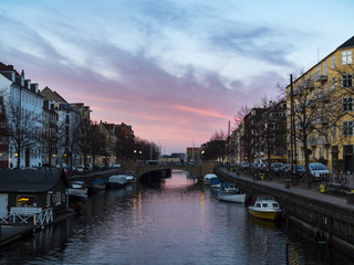 Sunset at the Copenhagen canals at Christianshavn, with colorful sky and twilight
