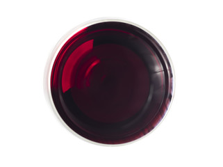 Glas of red wine pictured from above on white surface