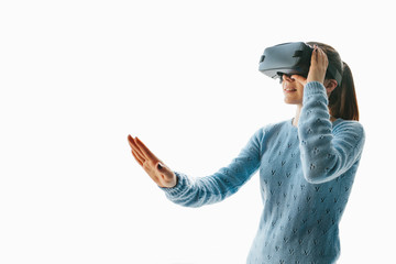 A young beautiful woman in glasses of virtual reality saw something amazing. Modern technologies.