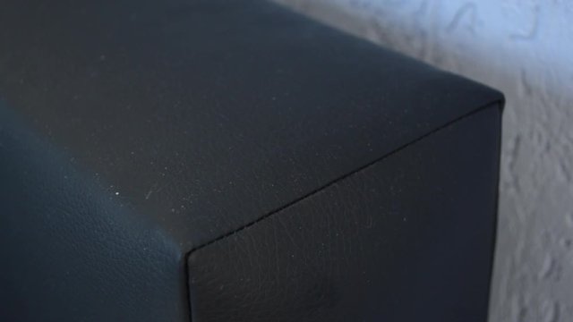 Close up of two hands unplugging a smartphone charger