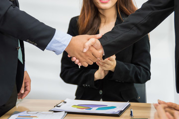 Half of the businessmen meeting for the planning meeting.