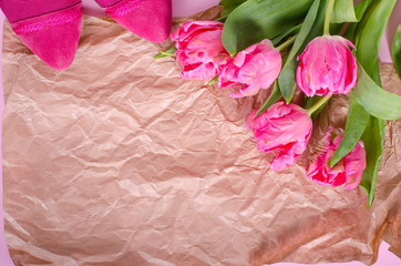 Beautiful pink tulips in paper on vintage paper. Free space for your text