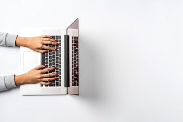 Naklejka na ściany i meble Female hands working on modern laptop. Office desktop with copy space.