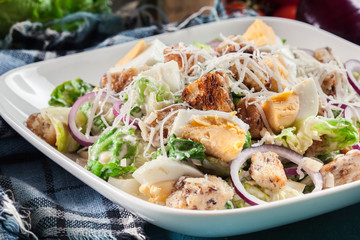 Healthy caesar salad with cheese, eggs and croutons
