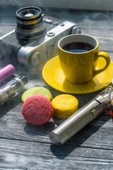 Still life with e-cig and jiuce on the wooden background
