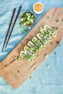 Overhead view of baked pastry served on cutting board