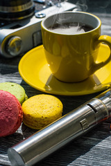 Still life with e-cig and jiuce on the wooden background