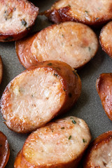 Macro close up on sliced sausage in a pan