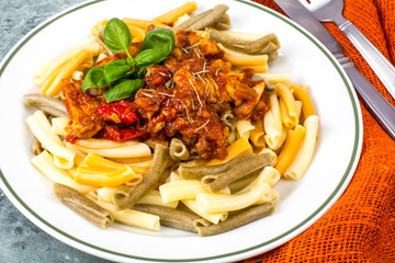 Pasta with chicken fillet, tomatoes, sweet pepper