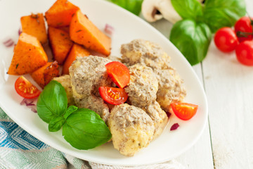 Meatballs with mushroom sauce and sweet potatoes