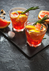 Grapefruit and rosemary gin cocktail, refreshing drink with ice