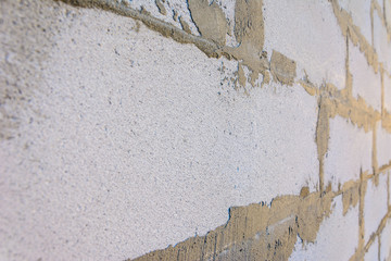 Gray wall of foam blocks on glutinous solution