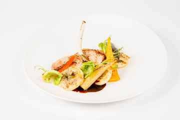 Meat dish with vegetables on a white background