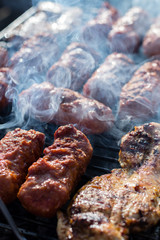 Close up pf delicious chicken breast on wooden skew with fresh vegetables, garlic, paprika fried on mangal barbeque grill