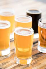 Close up on a flight of craft beer in pint glasses
