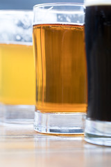 Side close up on a rainbow selection of beers
