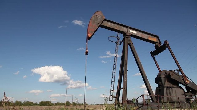 Oilwell Pump Jack in a Field Close