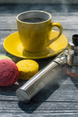 Still life with e-cig and jiuce on the wooden background