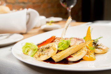 Meat dish with vegetables served in a restaurant