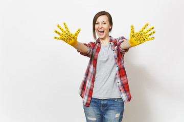 Young overjoyed woman showing hands in building yellow gloves with fun print on camera isolated on white background. Accessories for renovation apartment room. Repair home concept. Advertising area.