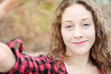 Young woman making selfie.