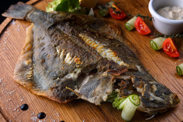 Fish flounder with lemon and vegetables