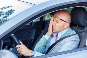 Confused man having problem with car