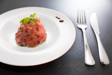 A delicious tartare of fresh Mediterranean tuna. Seasoned with extra virgin olive oil, chives, parsley and a few drops of orange juice.