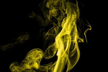 Yellow smoke on black background