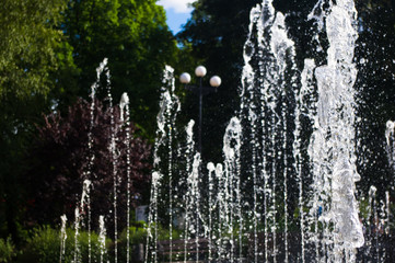 Fountain in city park on hot summer day