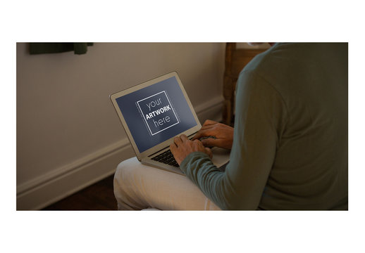 Laptop User in Bedroom Mockup