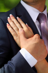 bride and groom with a bouquet close-up