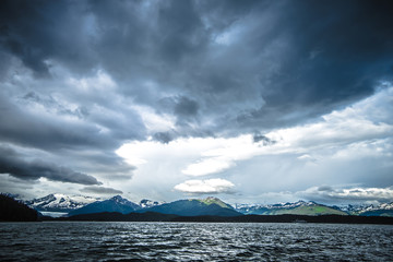 abstract cloudy waterscape AND MOUNTAIN RANGE IN ALASKA