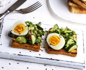 pieces of bread from white wheat flour with boiled egg
